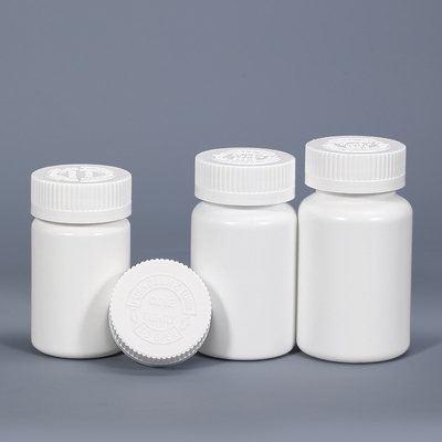 白い丸いプラスチック製の錠剤ボトル 子供用錠剤 カプセル 医薬品 保存